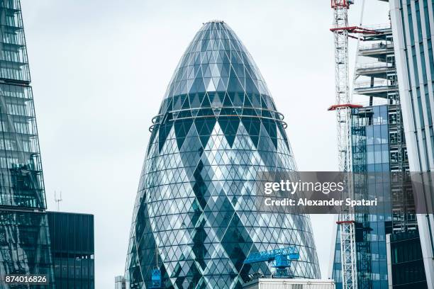 city of london skyline with new skyscraper under construction - london swiss re stock pictures, royalty-free photos & images