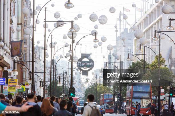 oxford street with christmas decorations, london, uk - daily life at oxford street london stock pictures, royalty-free photos & images