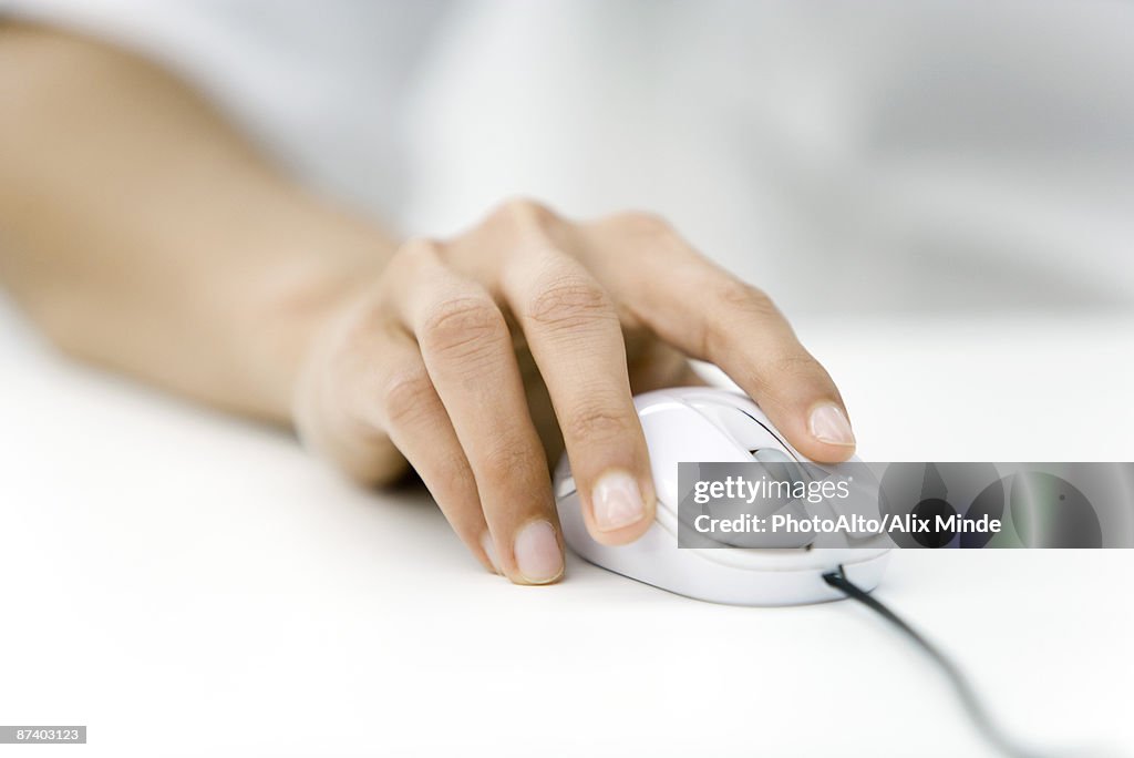 Hand using computer mouse, close-up