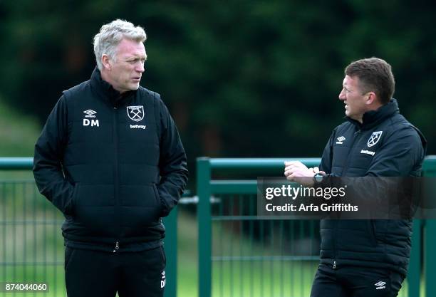 Billy McKinlay and David Moyes of West Ham United during Training at Rush Green on November 14, 2017 in Romford, England.