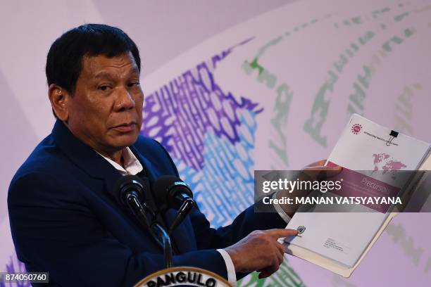 Philippine President Rodrigo Duterte addresses a press conference after the closing ceremony of the 31st Association of Southeast Asian Nations...