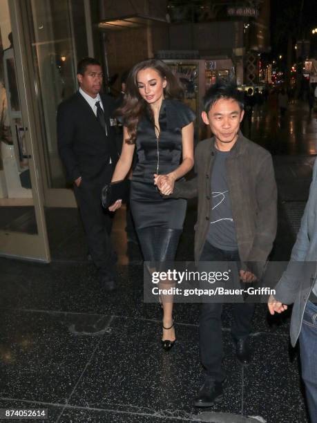 Actress Ingrid Bisu and director James Wan are seen arriving at the premiere of Warner Bros. Pictures' 'Justice League' at Dolby Theatre on November...