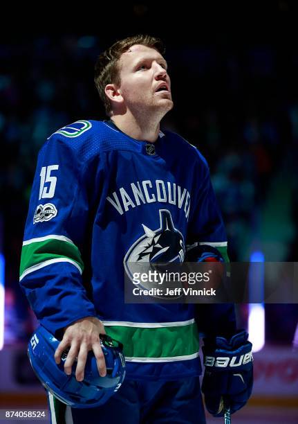 Derek Dorsett of the Vancouver Canucks listens to the national anthem during their NHL game against the Dallas Stars at Rogers Arena October 30, 2017...