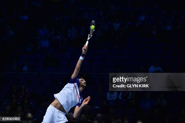 Croatia's Marin Cilic serves against USA's Jack Sock during their men's singles round-robin match on day three of the ATP World Tour Finals tennis...