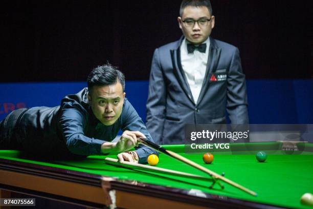 Marco Fu of Chinese Hong Kong plays a shot during the first round match against Hossein Vafaei of Iran on day two of 2017 Shanghai Masters at...