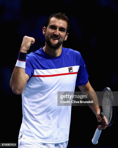 Marin Cilic of Croatia celebrates winning the 1st set during the singles match against Jack Sock of The United States on day three of the Nitto ATP...