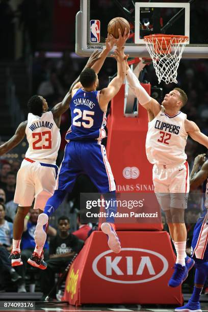 Ben Simmons of the Philadelphia 76ers drives to the basket against Blake Griffin of the LA Clippers on November 13, 2017 at STAPLES Center in Los...