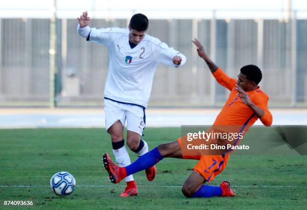 Palo Ghiglione of Italy U20 competes with Juninho Bacuna of Netherlands U20 during the 8 Nations Tournament match between Italy U20 and Netherlands...