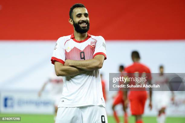 Mahdi Abdul Jabbar of Bahrain reacts after scoring the third goal during the 2019 Asian Cup Qualifier match between Singapore and Bahrain at National...