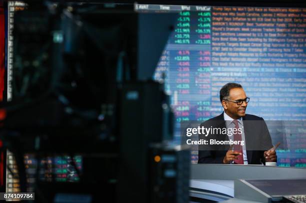 Rajiv Jain, chairman and chief investment officer of GQG Partners LLC, gestures while speaking during a Bloomberg Television interview in New York,...