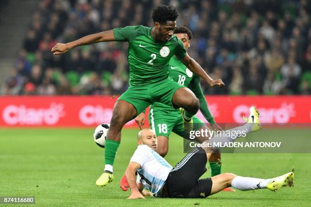 Nigeria's Ola Aina and Argentina's Javier Mascherano vie for the ball during an international friendly football match between Argentina and Nigeria...