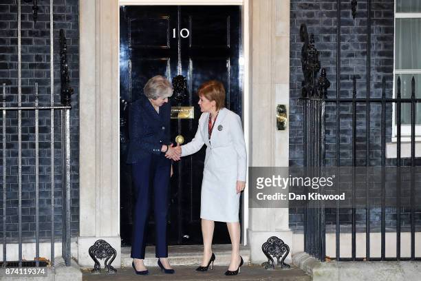 Britain's Prime Minister Theresa May greets First Minister and Scottish National Party Leader Nicola Sturgeon to 10 Downing Street on November 14,...