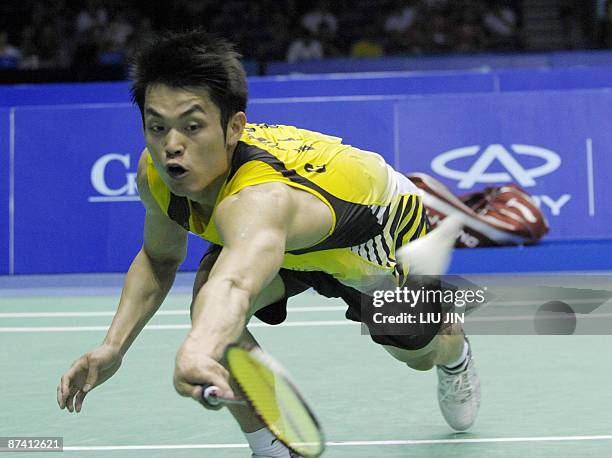 China's Lin Dan competes against Malaysia's Lee Chong Wei during the men's singles semifinal match at the Sudirman Cup world badminton championships...