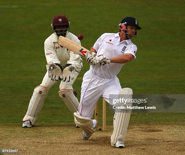 Paul Collingwood of England avoids a ball from Lendl Simmons of the West Indies, as Denesh Ramdin looks on during day three of the 2nd npower Test...