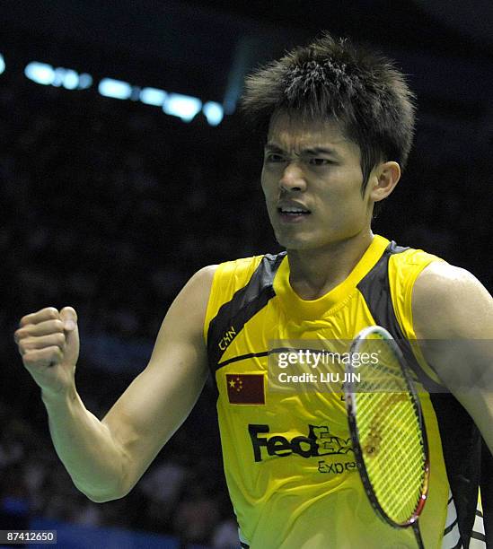 China's Lin Dan reacts to a winning point against Malaysia's Lee Chong Wei during the men's singles semifinal match at the Sudirman Cup world...