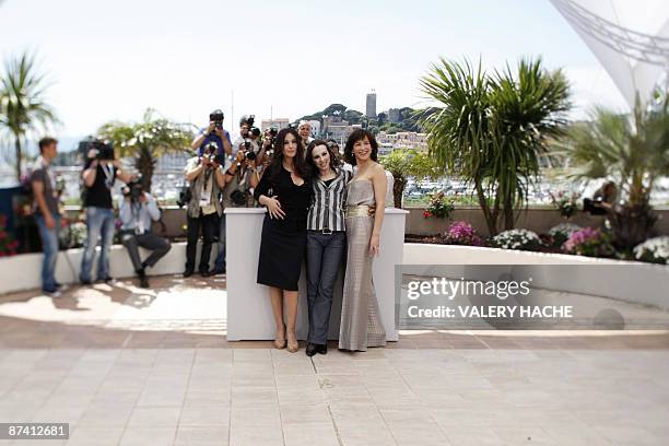 Photo taken with a tilt and shift lens shows French actress Sophie Marceau , Italian actress Monica Bellucci and French director Marina De Van posing...