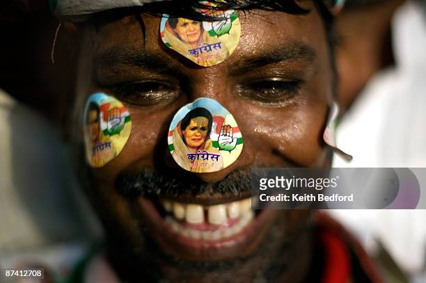 Man cheers as supporters celebrate election results in front of the headquarters of the Congress Party on May 16, 2009 in New Delhi, India. Senior...