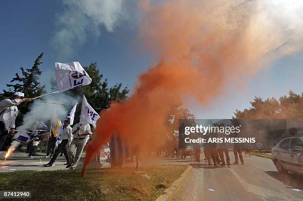 Members of right-wing nationalist Popular Orthodox Rally protest near the meeting place for the annual conference of the Bilderberg Club in Athens on...