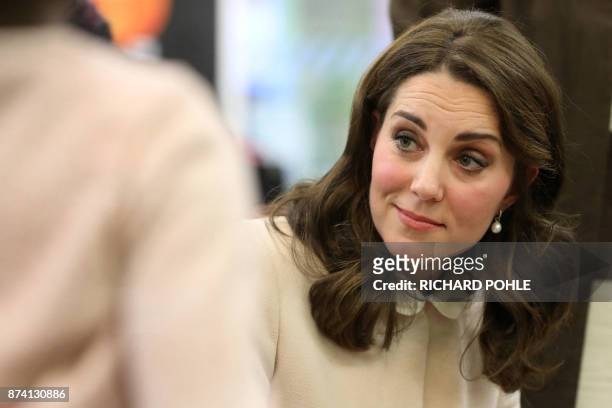 Britain's Catherine, Duchess of Cambridge listens during her visit to the Hornsey Road Children's Centre in north London on November 14, 2017.