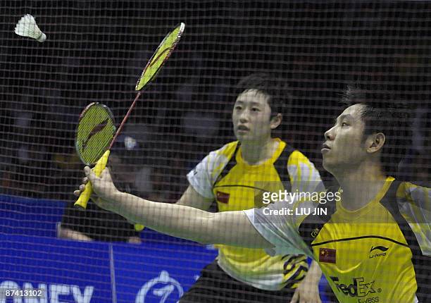 China's He Hanbin and his teammate Yu Yang compete against Malaysia's Mohd Fairuzizuan Mohd Tazari and Wong Pei Tty during the mixed doubles...