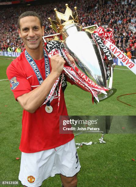 Rio Ferdinand of Manchester United celebrate with the Premier League trophy after the Barclays Premier League match between Manchester United and...