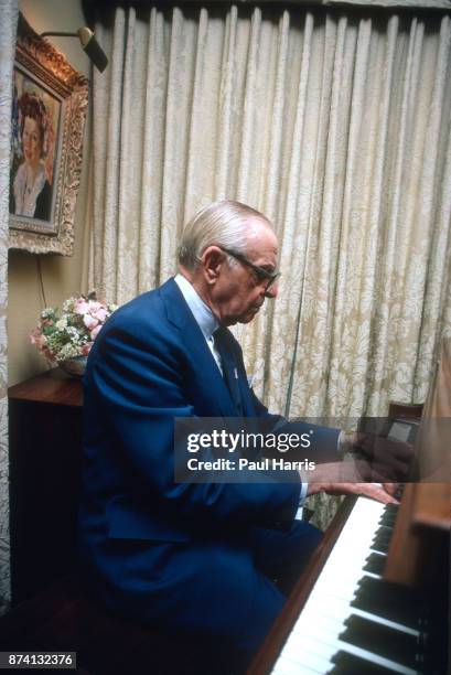 Dr Armand Hammer was an American business manager and owner, most closely associated with Occidental Petroleum, photographed at home playing the...