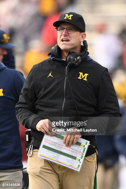 Head coach Jim Harbaugh of the Michigan Wolverines looks on during a college football game against the Maryland Terrapins at Capitol One Field on...