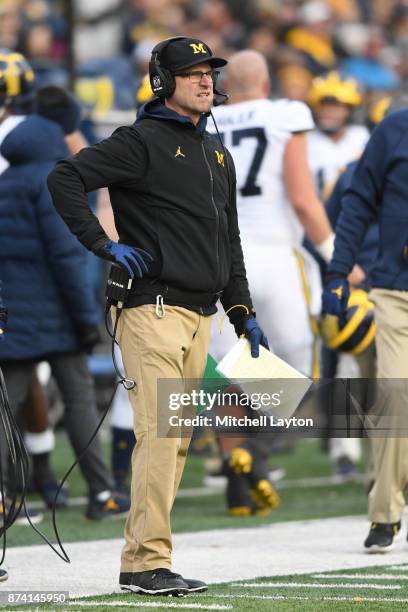 Head coach Jim Harbaugh of the Michigan Wolverines looks on during a college football game against the Maryland Terrapins at Capitol One Field on...