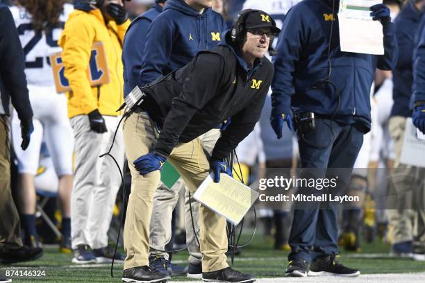 Head coach Jim Harbaugh of the Michigan Wolverines looks on during a college football game against the Maryland Terrapins at Capitol One Field on...