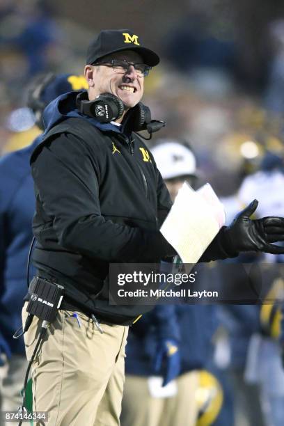 Head coach Jim Harbaugh of the Michigan Wolverines looks on during a college football game against the Maryland Terrapins at Capitol One Field on...