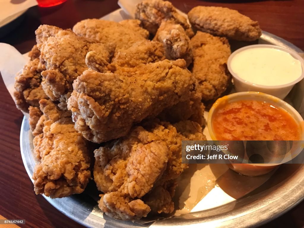 Plate of buffalo chicken wings with sauce