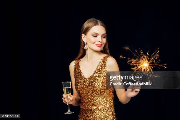 smiling girl with christmas sparkler - champagne flute milk stock pictures, royalty-free photos & images