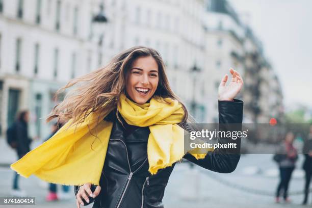 young woman running on the street - female waving on street stock pictures, royalty-free photos & images