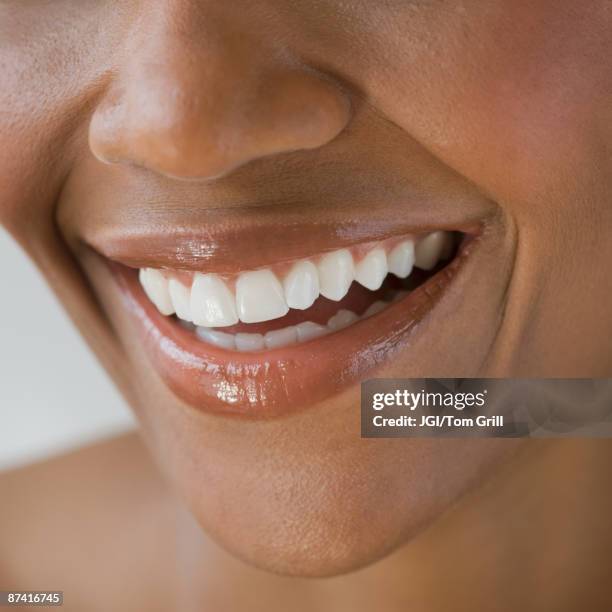 close up of african woman smiling - smiling lips stock pictures, royalty-free photos & images