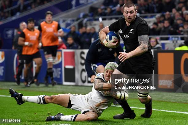 New Zealand's flanker Liam Squire is tackled by France's right wing Gabriel Lacroix during the international rugby union test match between France...