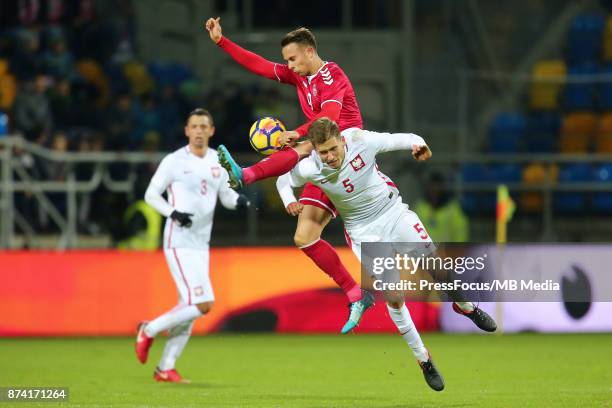 Marcus Ingvartsen of Denmark and Pawel Bochniewicz of Poland during UEFA U21 Championship Qualifier match between Poland and Denmark on November 14,...