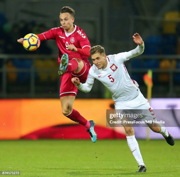 Marcus Ingvartsen of Denmark and Pawel Bochniewicz of Poland during UEFA U21 Championship Qualifier match between Poland and Denmark on November 14,...