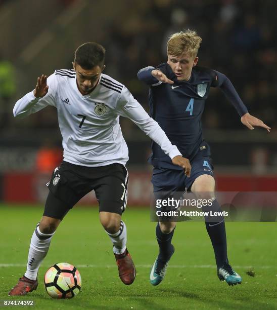 Oliver Batista Meier of Germany holds off Thomas Doyle of England during the International Match between England U17 and Germany U17 at The New York...