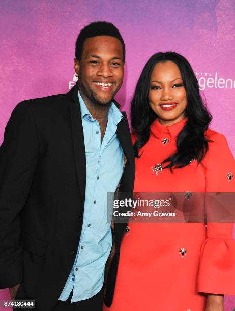 Oliver Saunders and Garcelle Beauvais attend Fonkoze's "Hot Night In Haiti" Los Angeles Event on November 11, 2017 in Los Angeles, California.