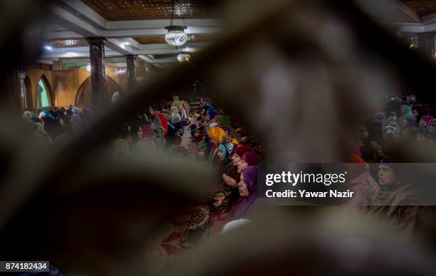 Kashmiri Muslim women devotees prays at the shrine of the Sufi saint Sheikh Hamza Makhdoom during a festival on November 14, 2017 in Srinagar, the...