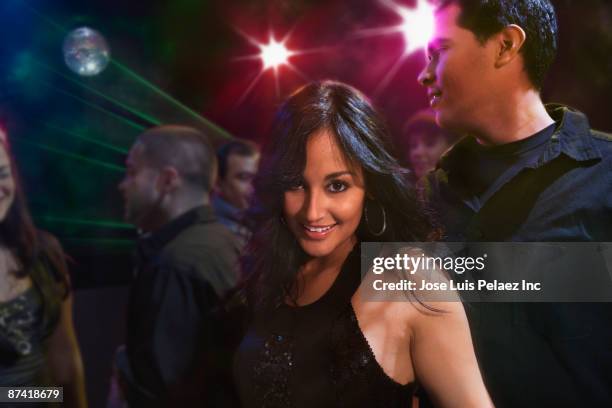 hispanic friends dancing in nightclub - adult glamour stock pictures, royalty-free photos & images