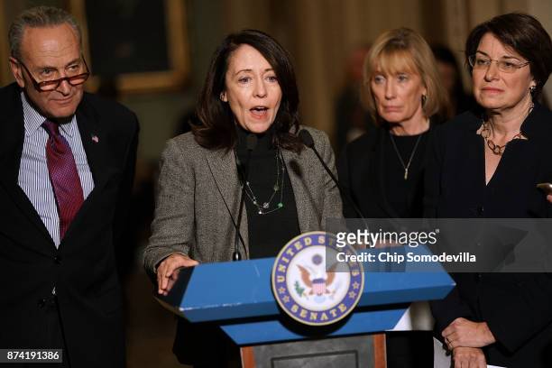Senate Minority Leader Charles Schumer , Sen. Maria Cantwell , Sen. Maggie Hassan and Sen. Amy Klobuchar talk to reporters following the weekly...