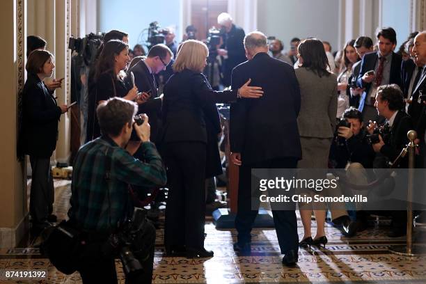 Senate Minority Leader Charles Schumer , Sen. Maria Cantwell , Sen. Maggie Hassan and Sen. Amy Klobuchar talk to reporters following the weekly...