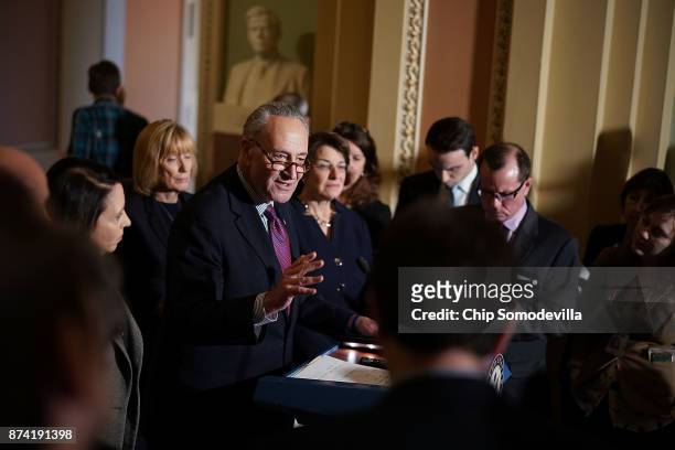 Senate Minority Leader Charles Schumer is joined by Sen. Maria Cantwell , Sen. Maggie Hassan and Sen. Amy Klobuchar while talking to reporters...