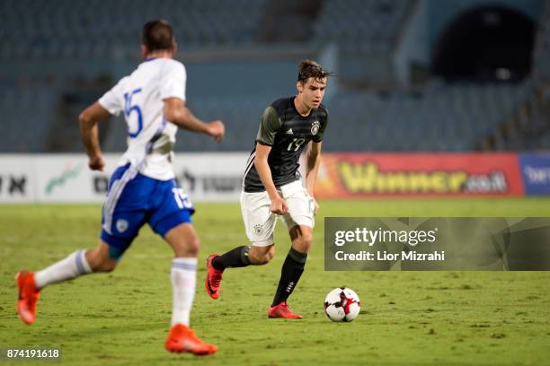 Florian Neuhaus of Germany vies with Raz Nahmias of Israel during the UEFA Under21 Euro 2019 Qualifier on November 14, 2017 in Ramat Gan, Israel.