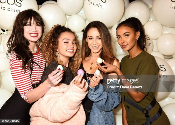 Daisy Lowe, Ella Eyre, Danielle Peazer and Maya Jama attend the EOS Lip Balm Winter Lips Party at Southbank Centre on November 14, 2017 in London,...