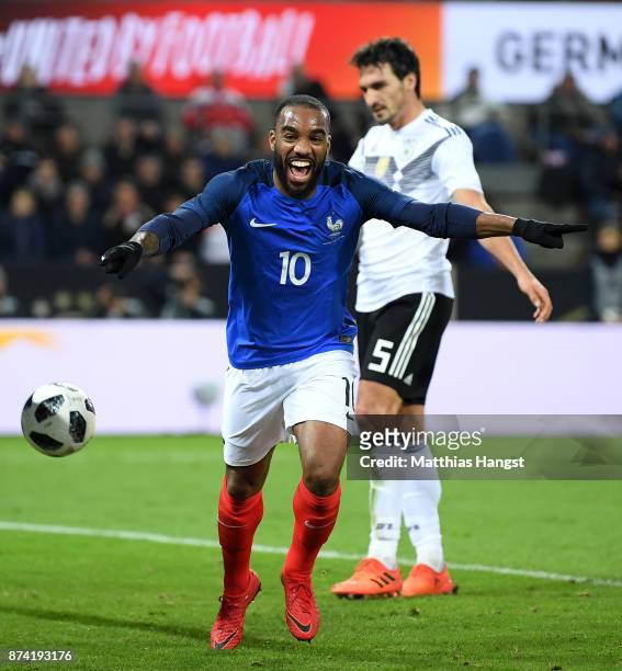 Alexandre Lacazette of France celebrates scoring his sides first goal during the international friendly match between Germany and France at...
