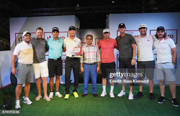 Haotong Li of China poses with the winners trophy and Francesco Molinari of Italy, Ian Poulter of England, Rafa Cabrera Bello of Spain, Pawan Munjal,...