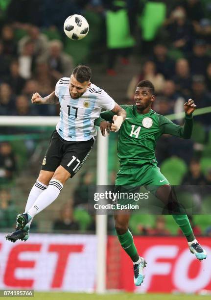 Nicolas Otamendi of Argentina heads for the ball with Kelechi Iheanacho of Nigeria during an international friendly match between Argentina and...