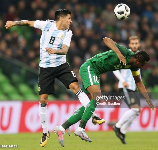 Enzo Perez of Argentina fights for the ball with John Obi Mikel of Nigeria during an international friendly match between Argentina and Nigeria at...